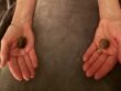A person resting with crystals placed on the body and in the palms to support chakra balance and energy alignment.