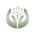 Green hands gently holding a lotus flower, symbolising calm, care and reflexology rooted in finding strength in stillness.